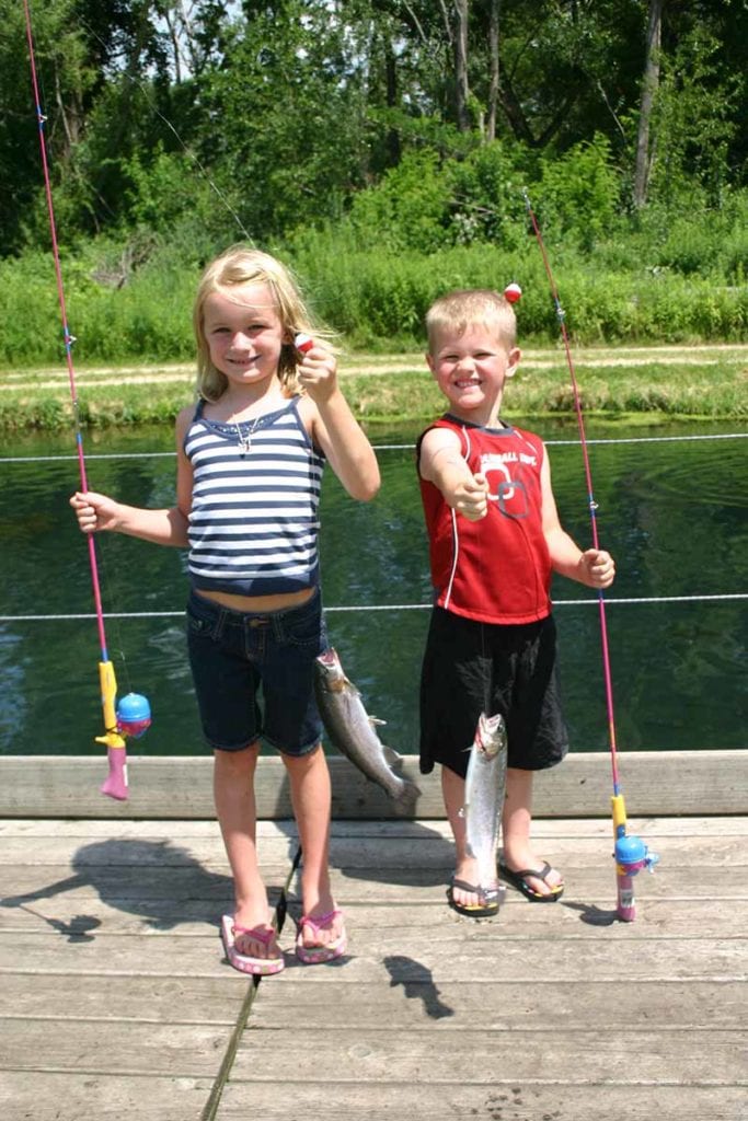 Two kids with fishing poles